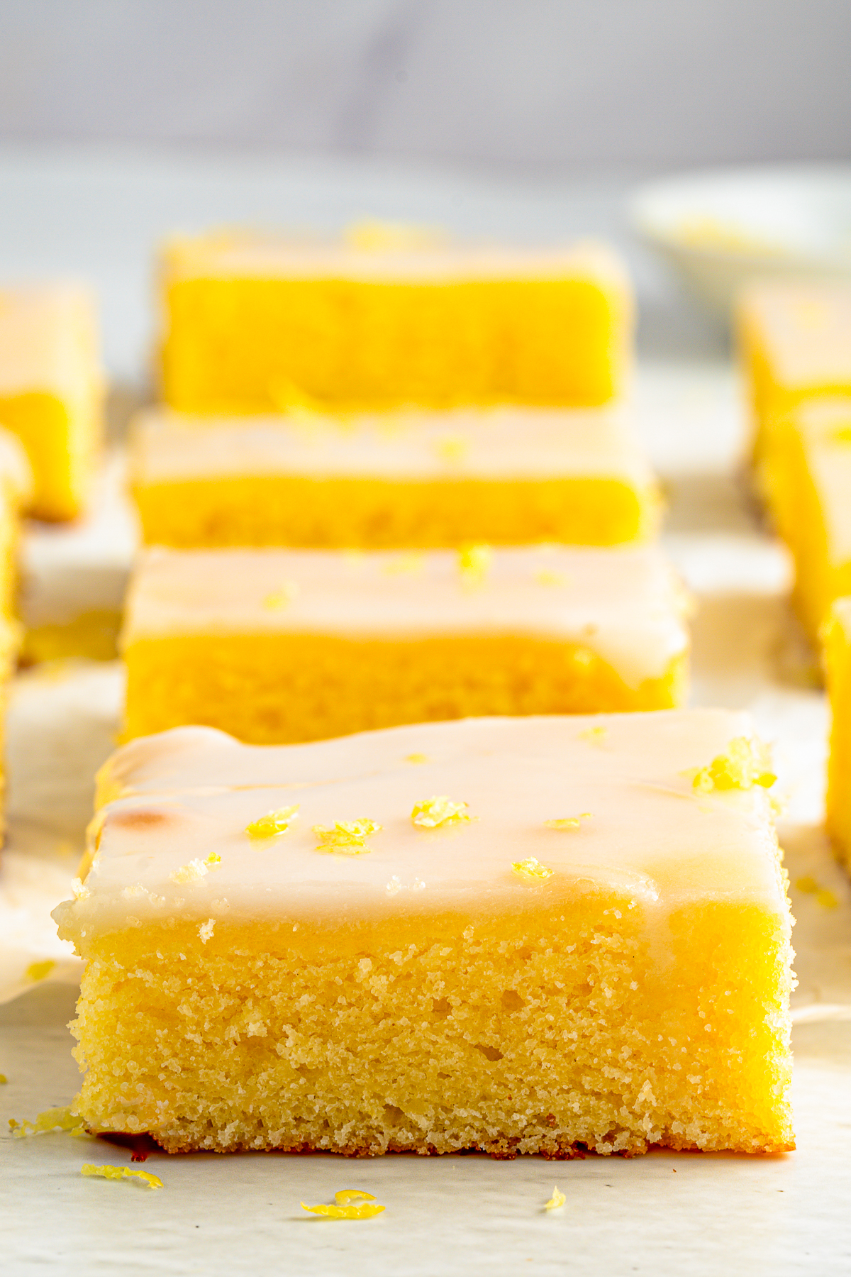 Close up of cut Lemon Brownies lined up in a row.