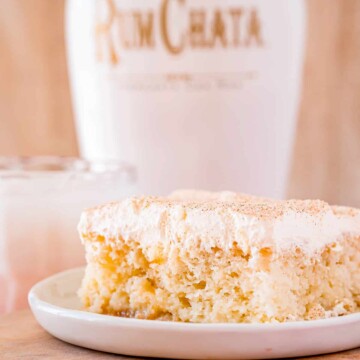 Close up of side of cake showing the filling with alcohol in background.