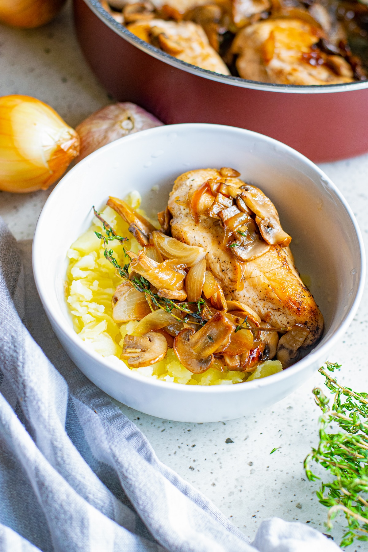 Bowl of Chicken with Mushrooms over mashed potatoes.