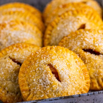 Closeup of one Apple Hand Pie in metal tin.