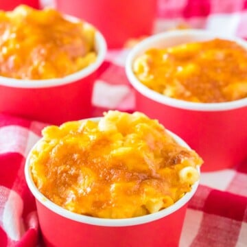 Three cups of the Chick-Fil-A Mac and Cheese Recipe on checkered linen.