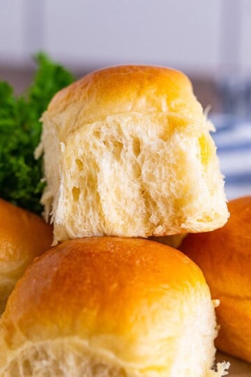 Close up of one stacked Dinner Roll on top of others.