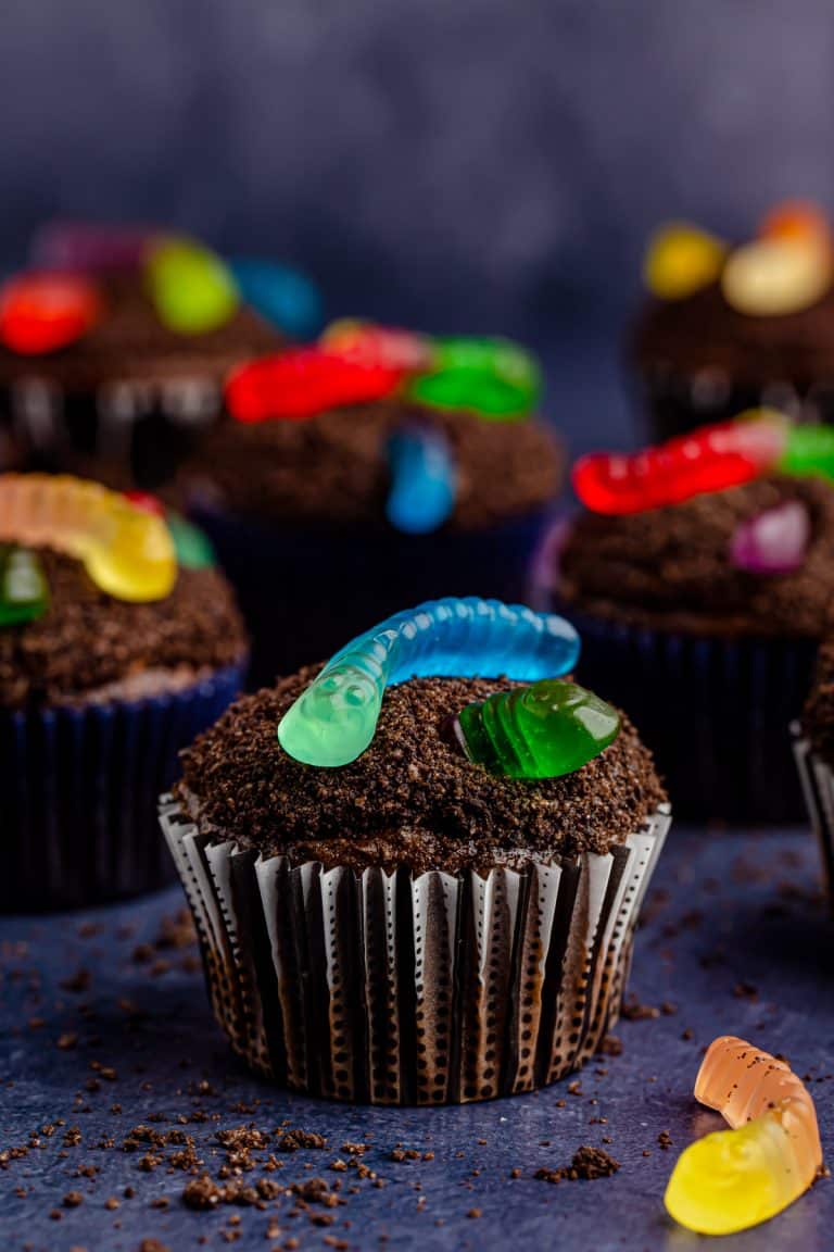 Close up of one of the finished Dirt Cupcakes showing the gummy worms.