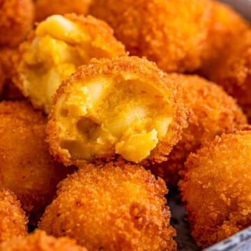 Close up of one opened Fried Mac and Cheese stacked on metal tray.
