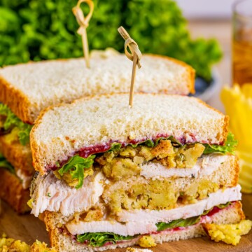 Close up of cut in half Leftover Turkey Sandwich Moistmaker showing layers.