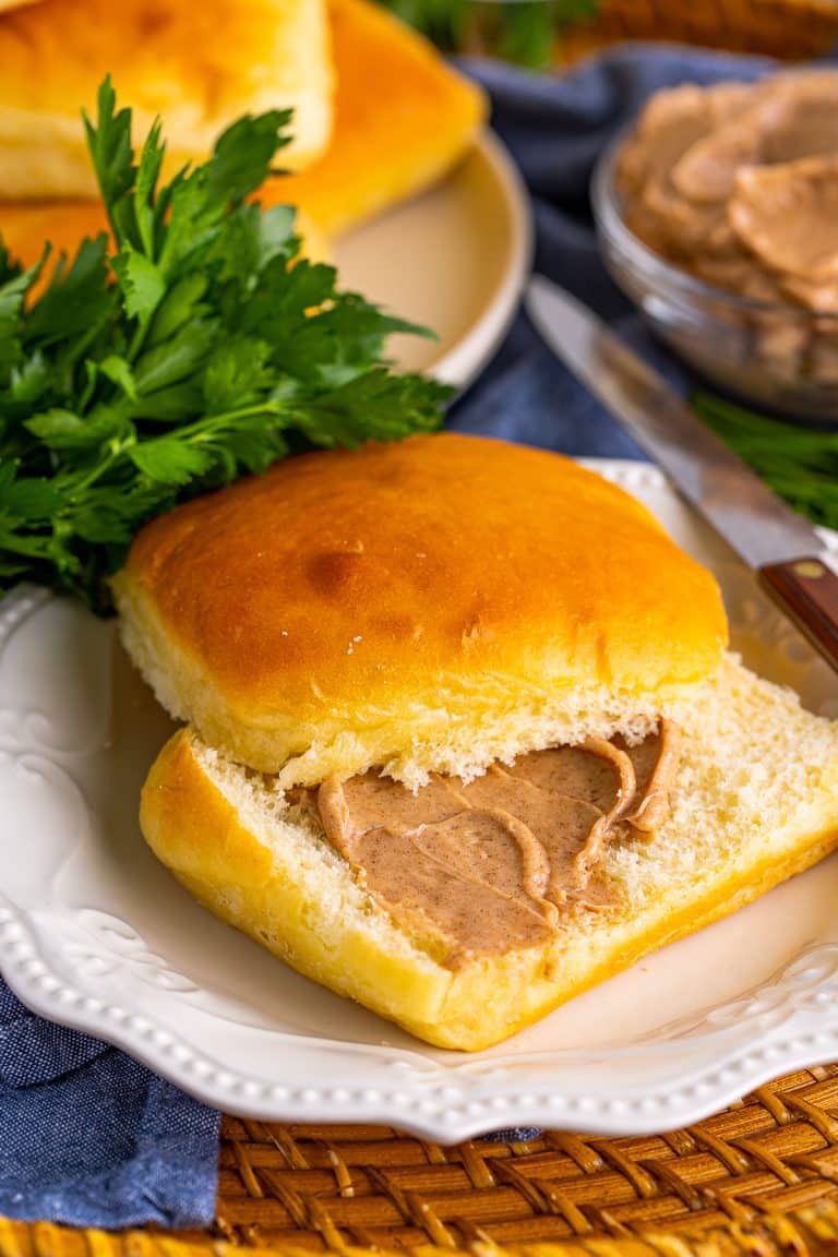 On roll on plate cut in half and spread with cinnamon butter.