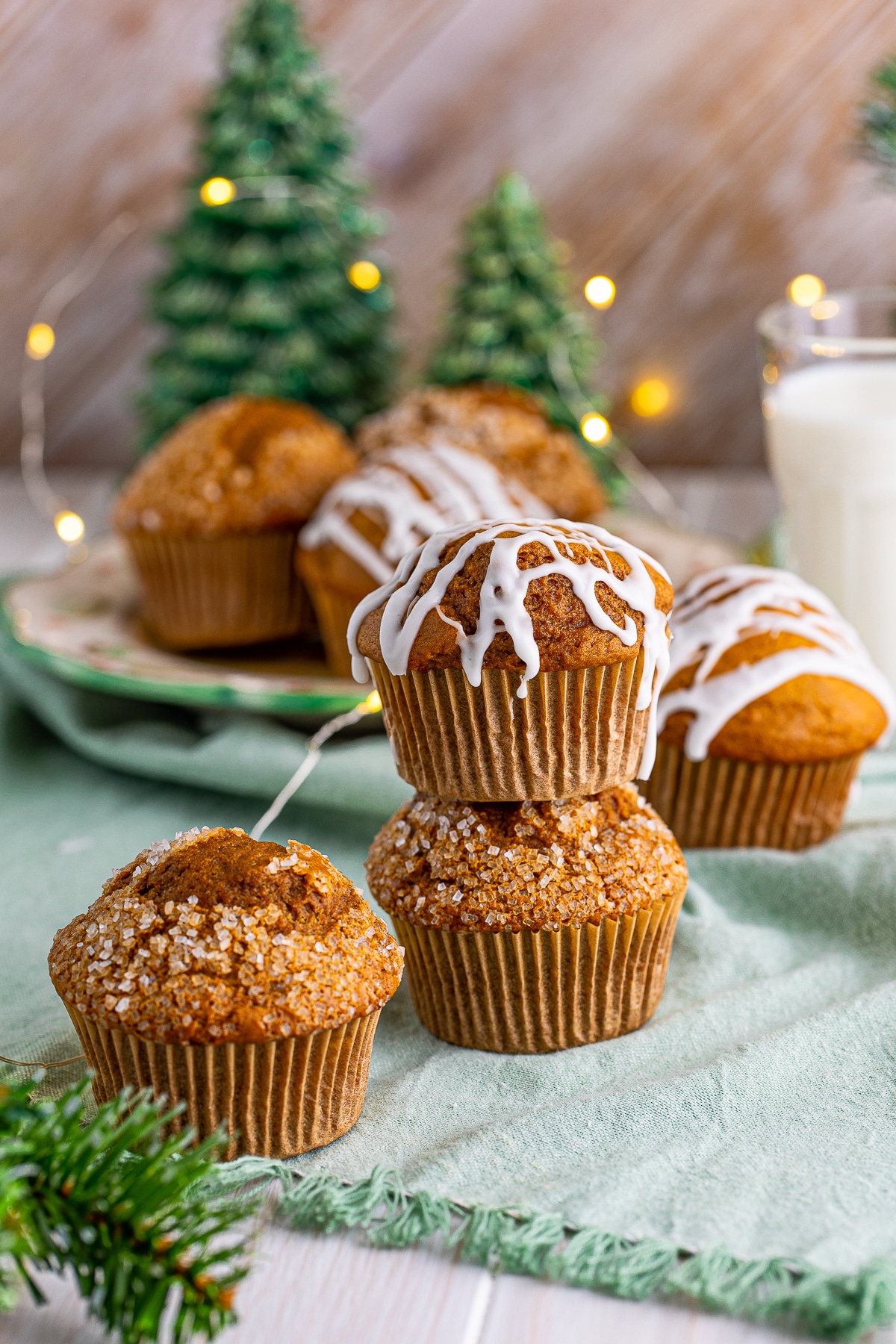 Two stacked Gingerbread Muffins with other beside it.