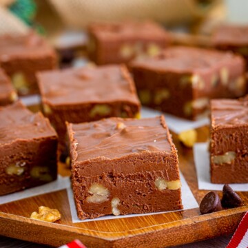 Close up of one piece of Fudge with Nuts on parchment paper.