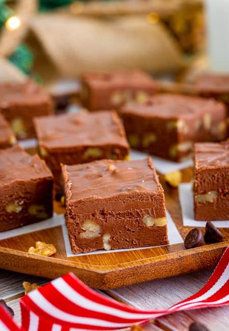 Close up of one piece of Fudge with Nuts on parchment paper.