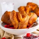 Popover Recipe in white dish with fruit.