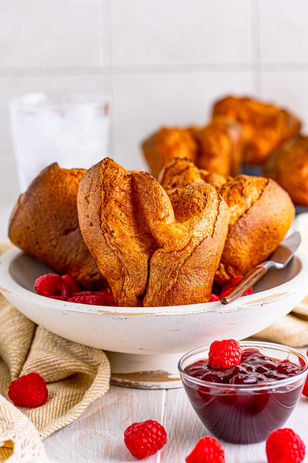 Popover Recipe in white dish with fruit.