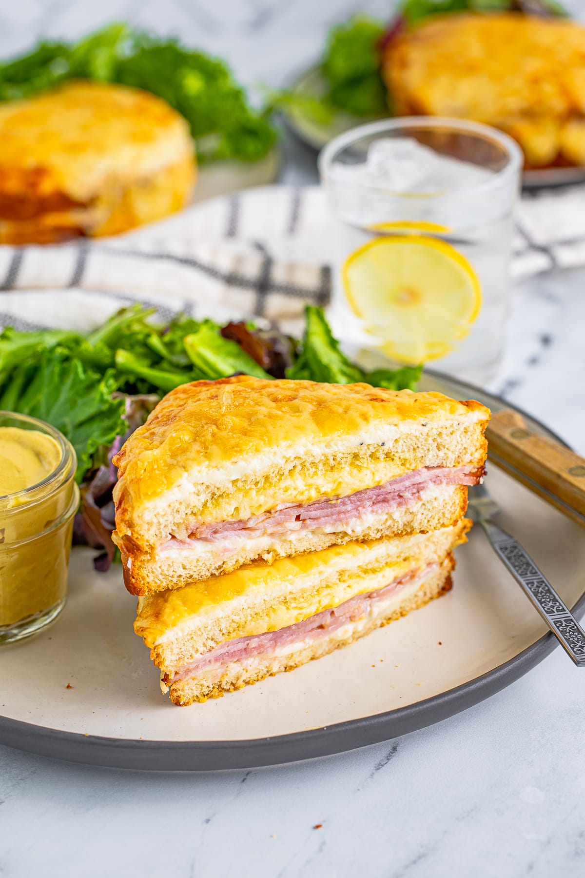 Two stacked slices of the Croque Monsieur Recipe on plate.