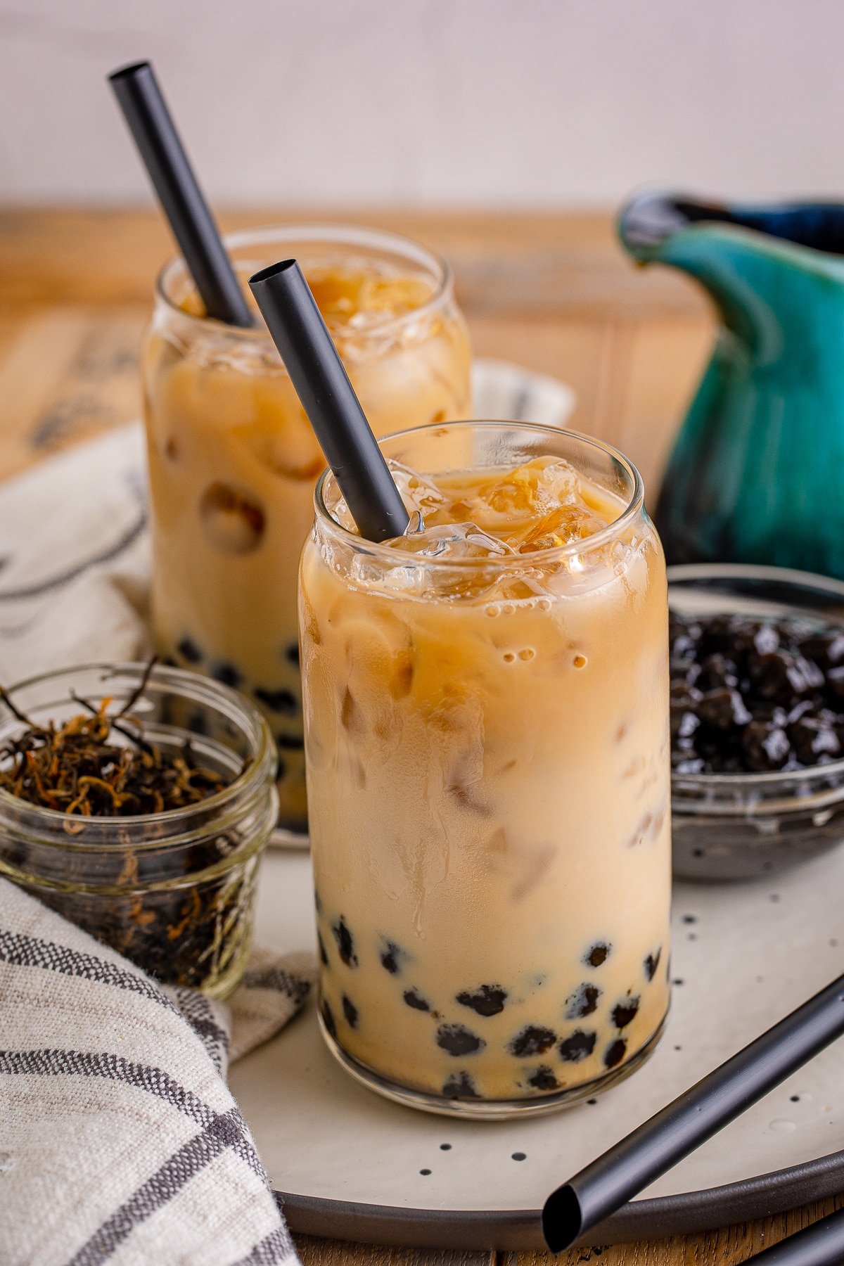 Boba Tea Recipe in two glasses with black straws.