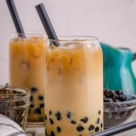 Boba Tea Recipe in two classes on white tray with black handles.