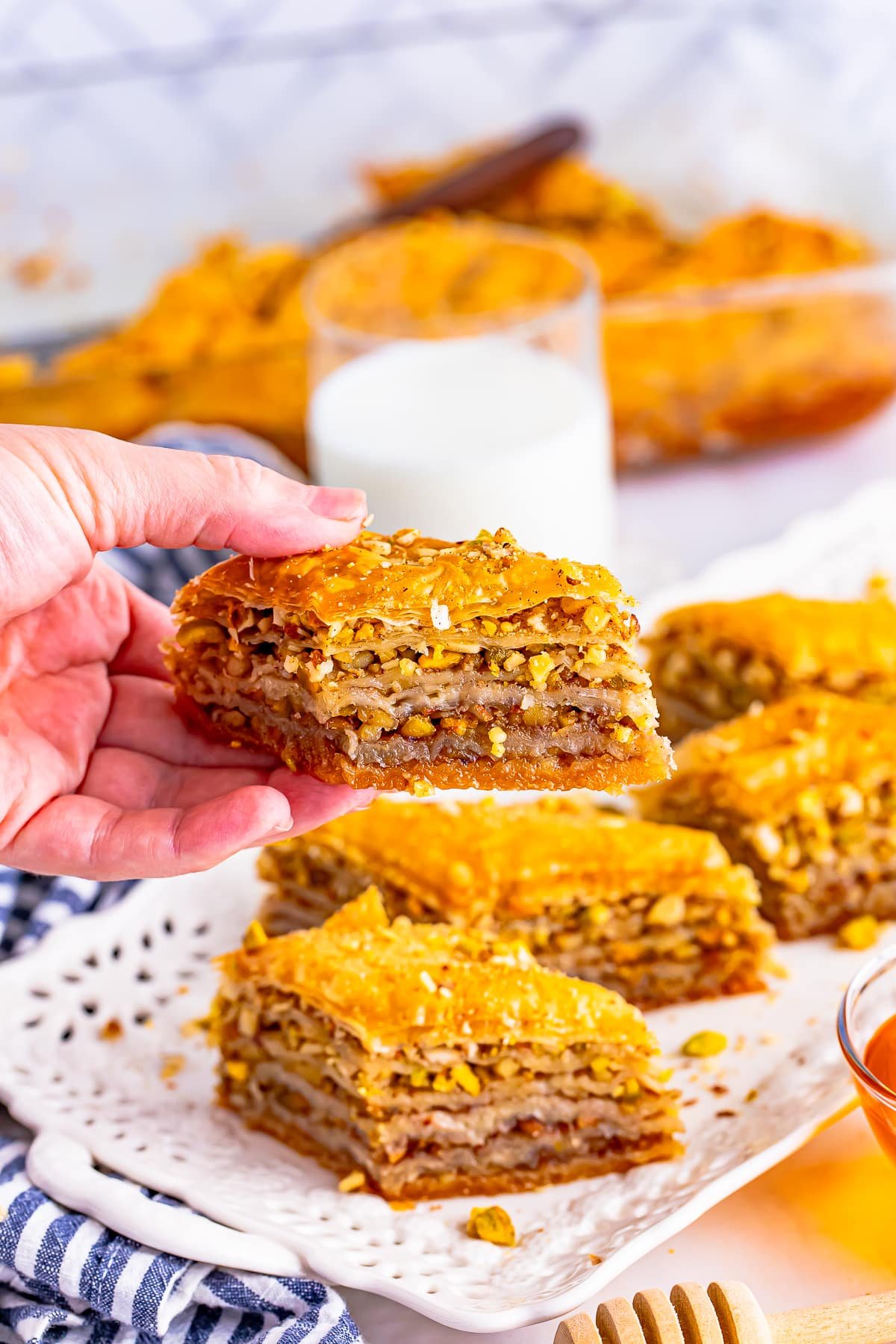 Slice of Easy Baklava Recipe being held up by a hand.