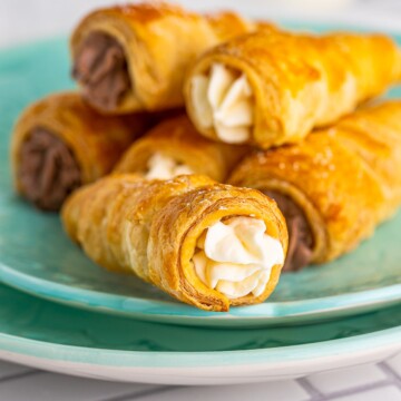 Close up of one of the filled Cream Horns on plate.