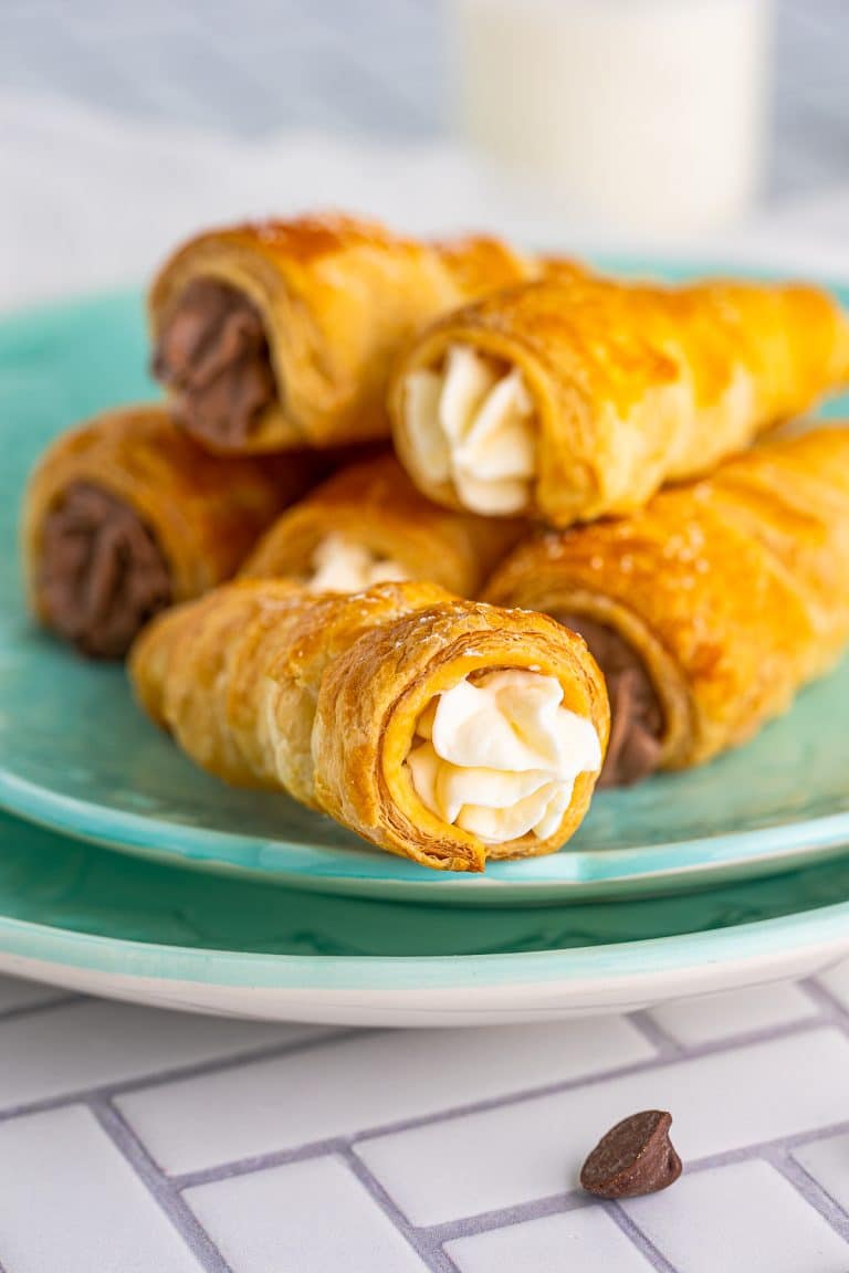 Close up of one of the filled Cream Horns on plate.