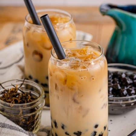 Boba Tea Recipe in two glasses with black straws.