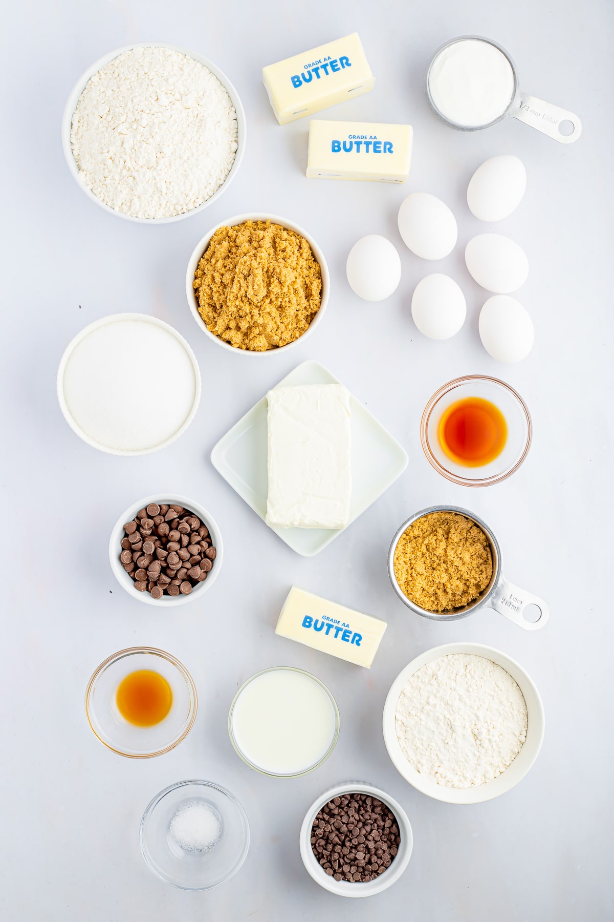 Overhead image of ingredients needed to make chocolate chip bundt cake on white table top