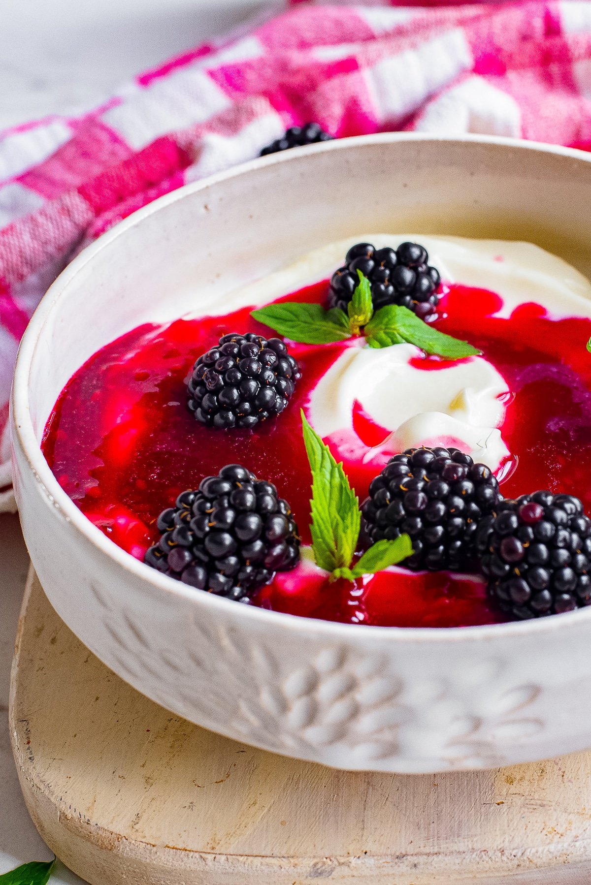 blackberry sauce on top of a bowl with yogurt