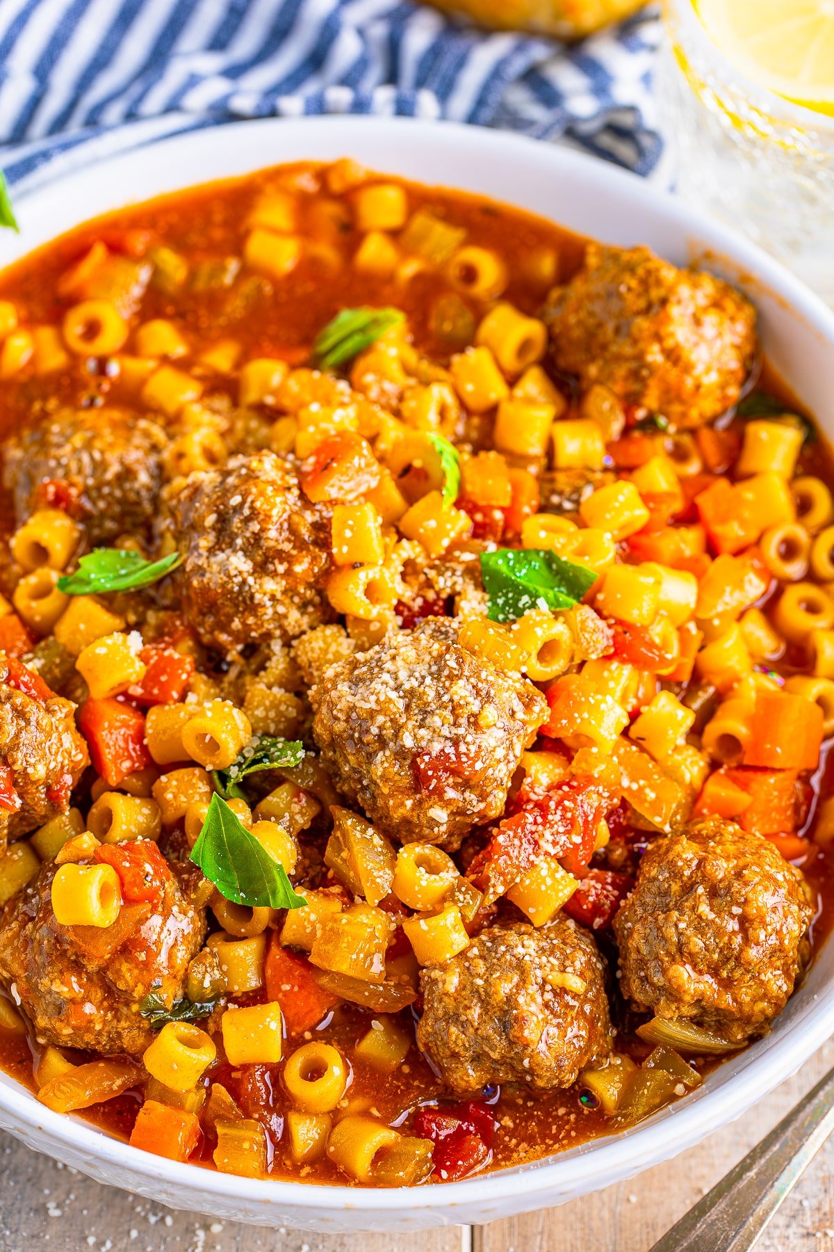 up close image of meatball soup recipe in a white bowl