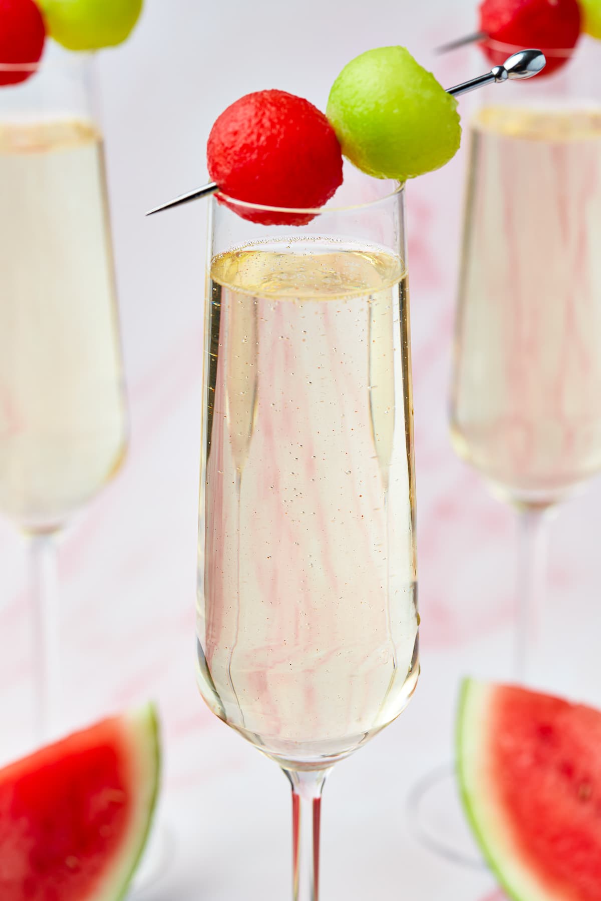 melon cocktails with pink back drop
