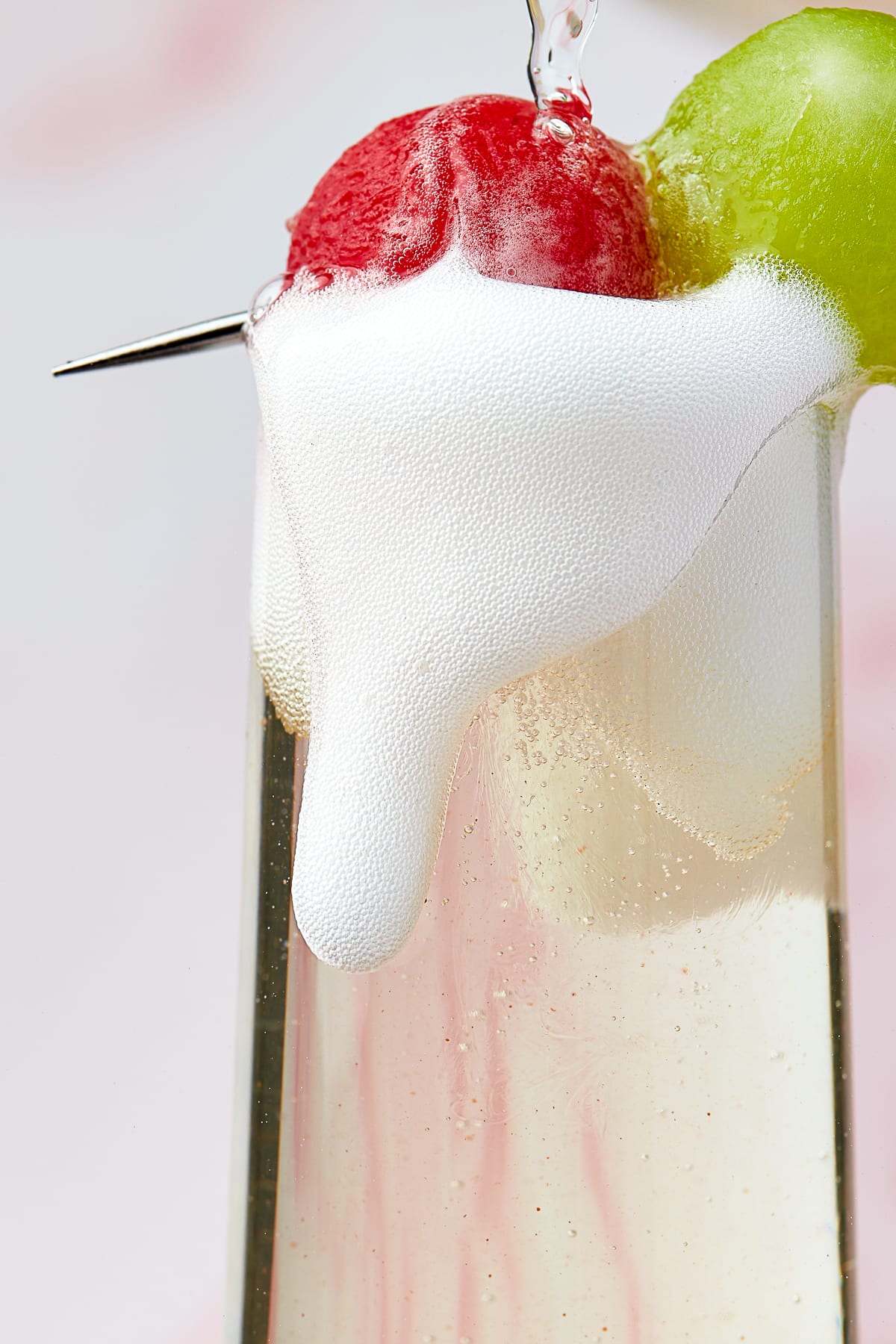 up close image of prosecco being poured into melon cocktails