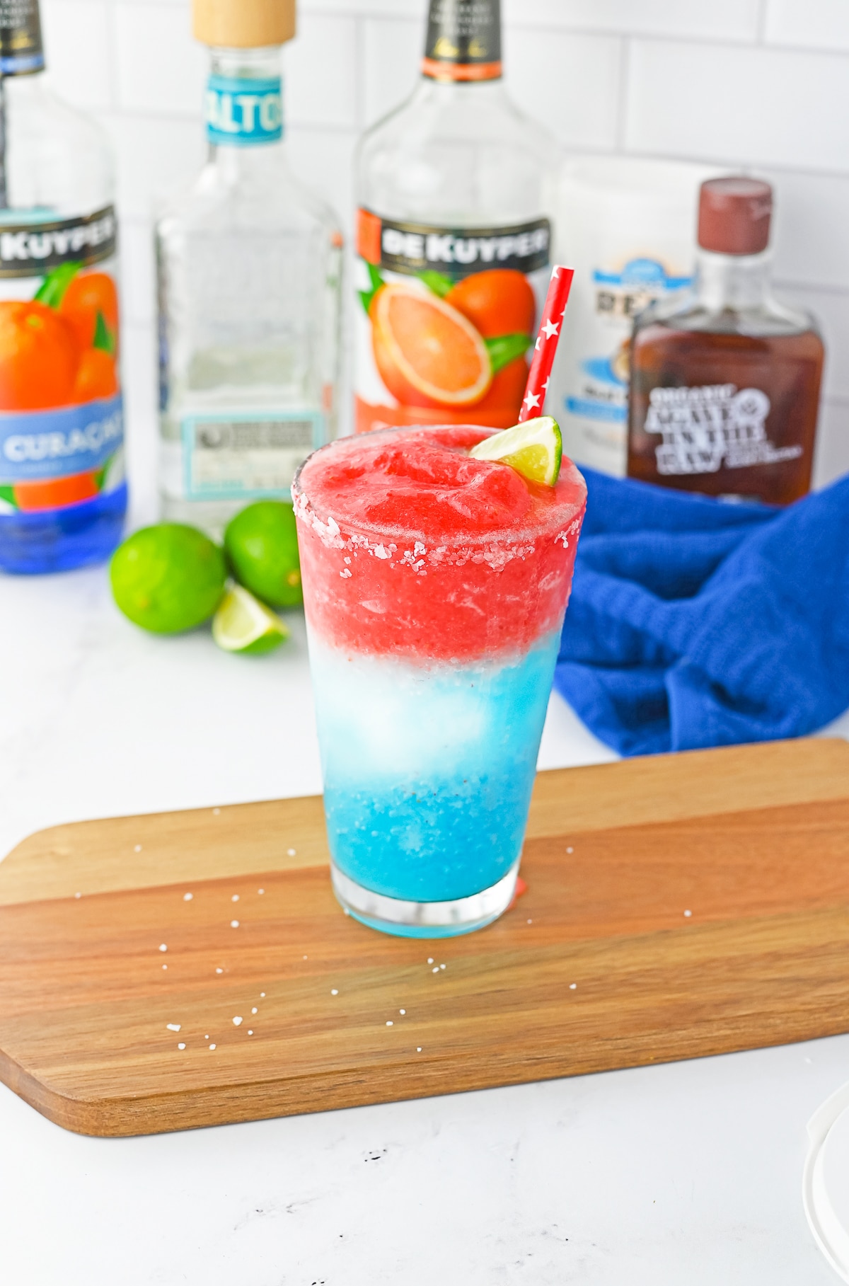 red white and blue cocktail on a wood board