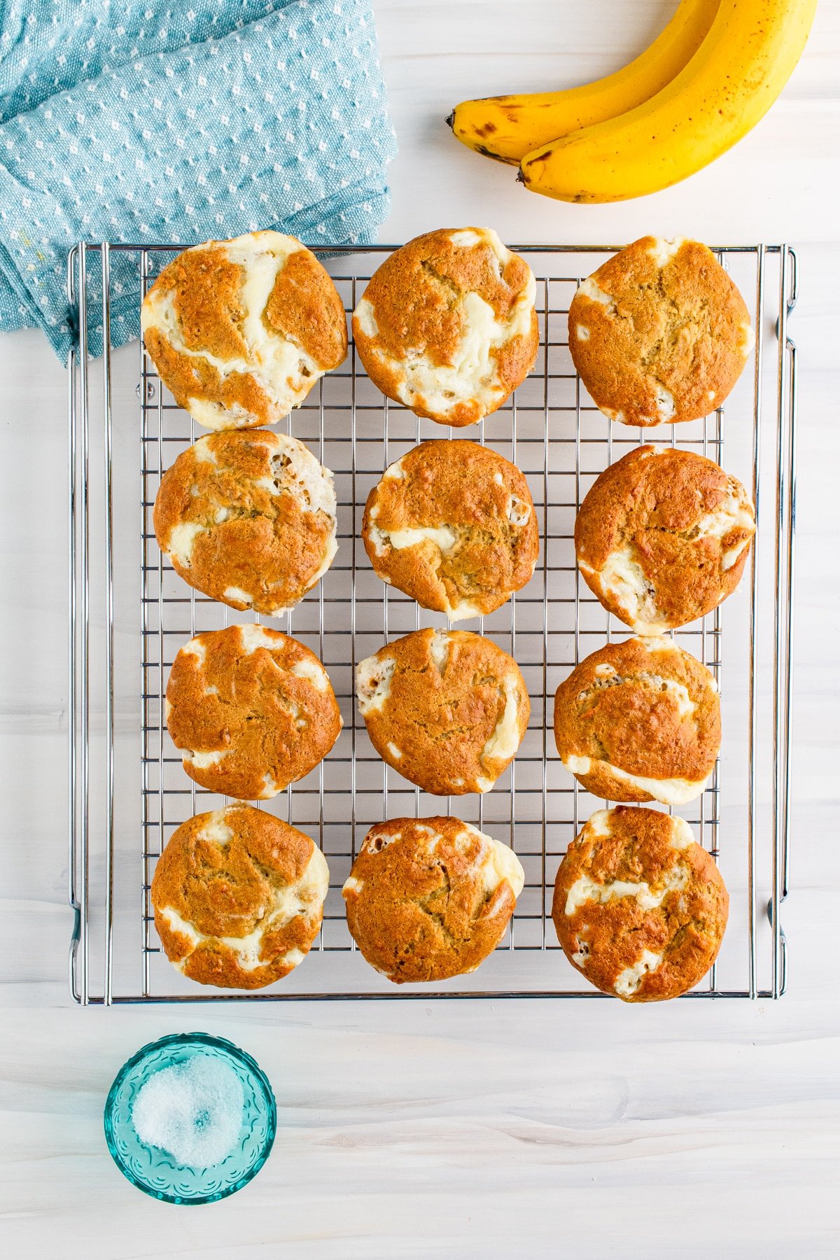 overhead image of cream cheese muffins on a cooling rack