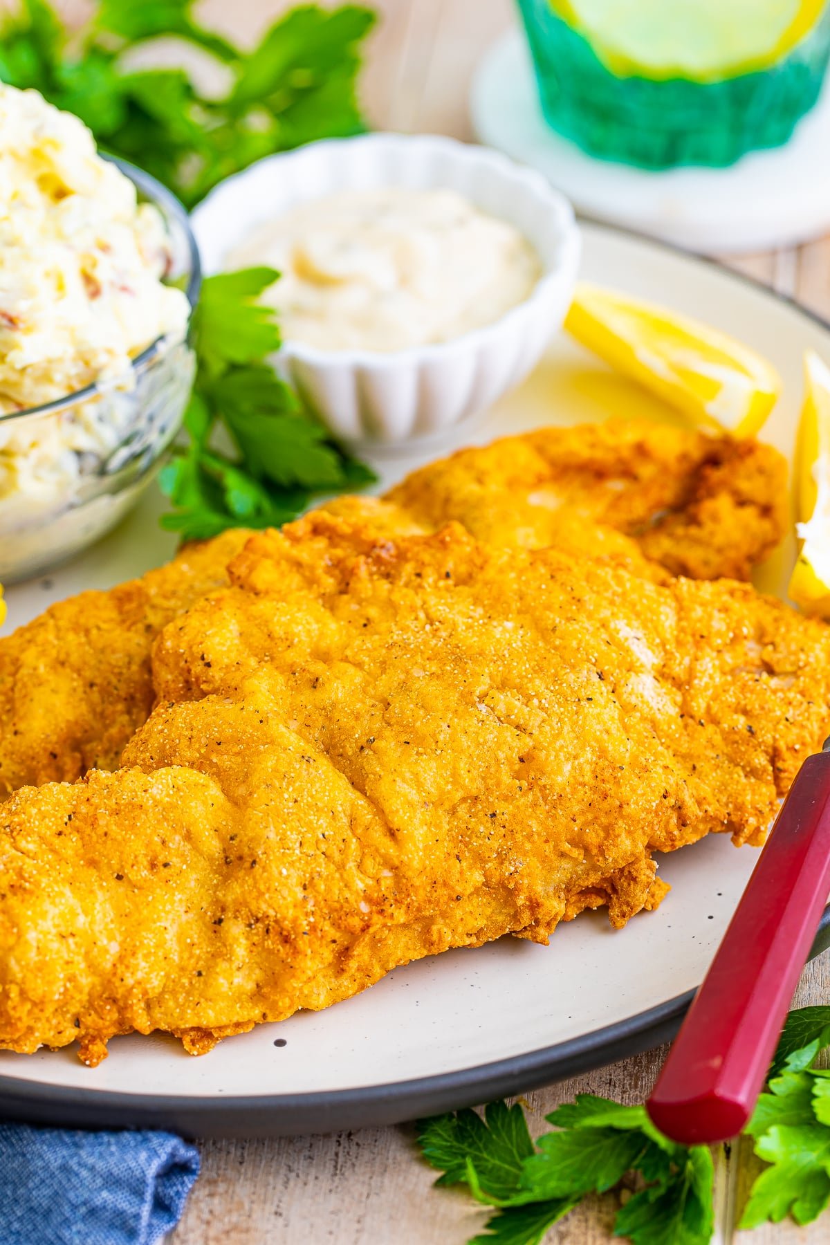 fried catfish recipe on a tan plate