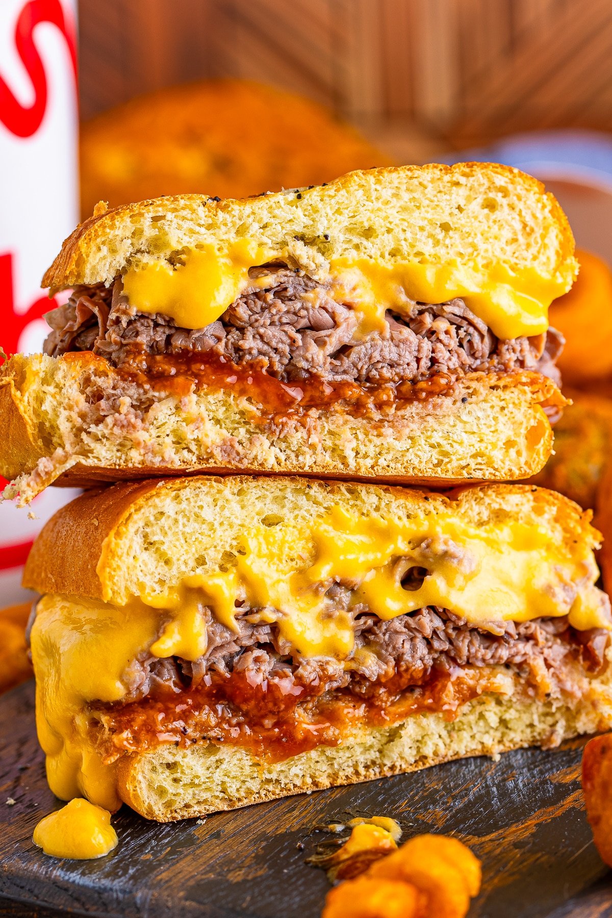 arbys beef and cheddar cut in half and stacked on top of each other
