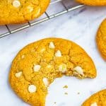 A plate of soft white chocolate chip cookies loaded with creamy white chocolate chips.