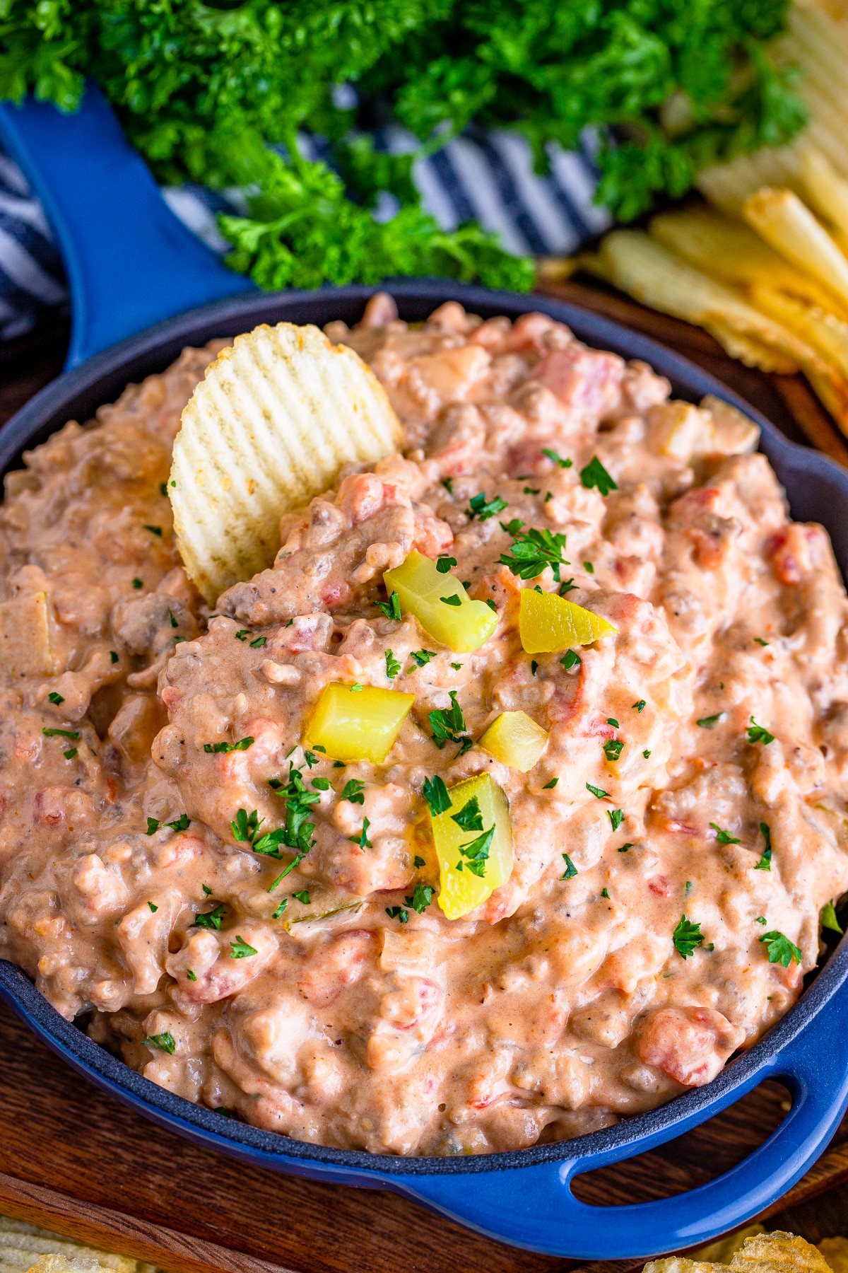 cheeseburger dip in a skillet with chips