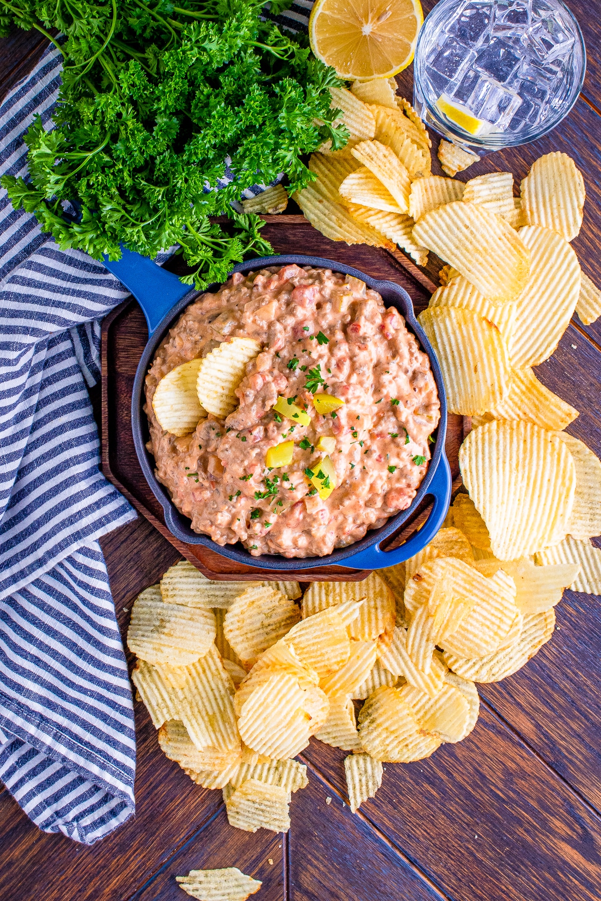 overhead image of cheeseburger dip served in a skillet with chips