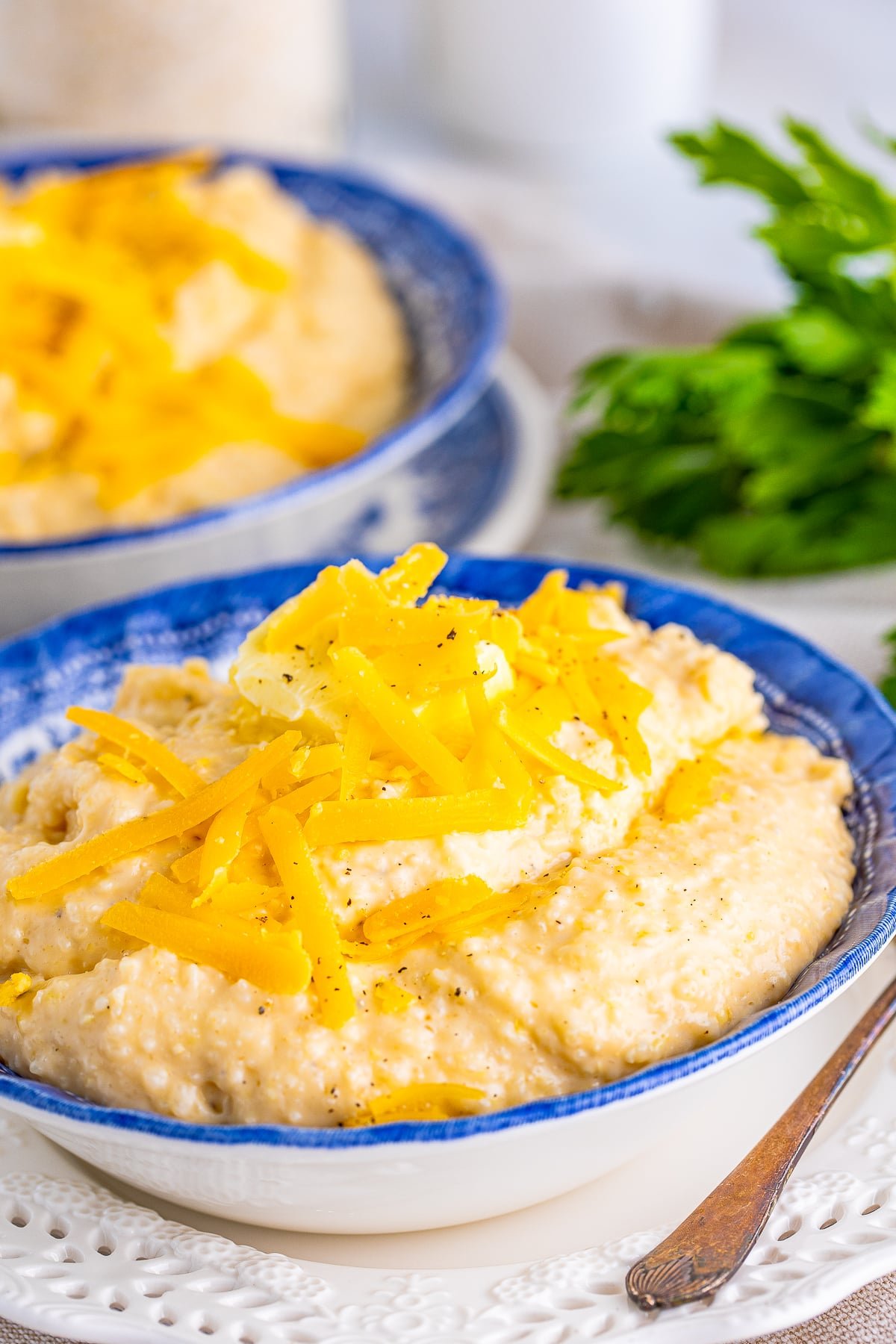 cheesy grits in a blue bowl