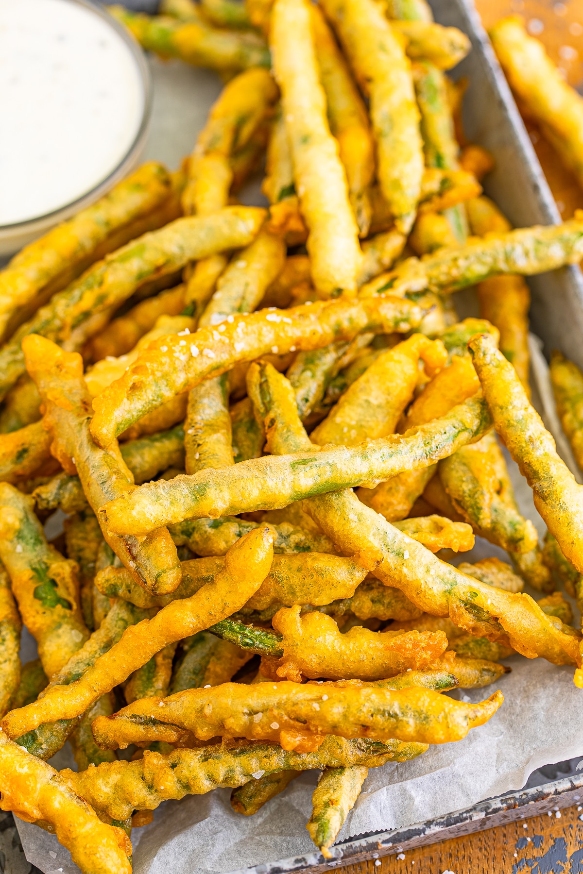 upclose fried green beans recipe in metal serving dish