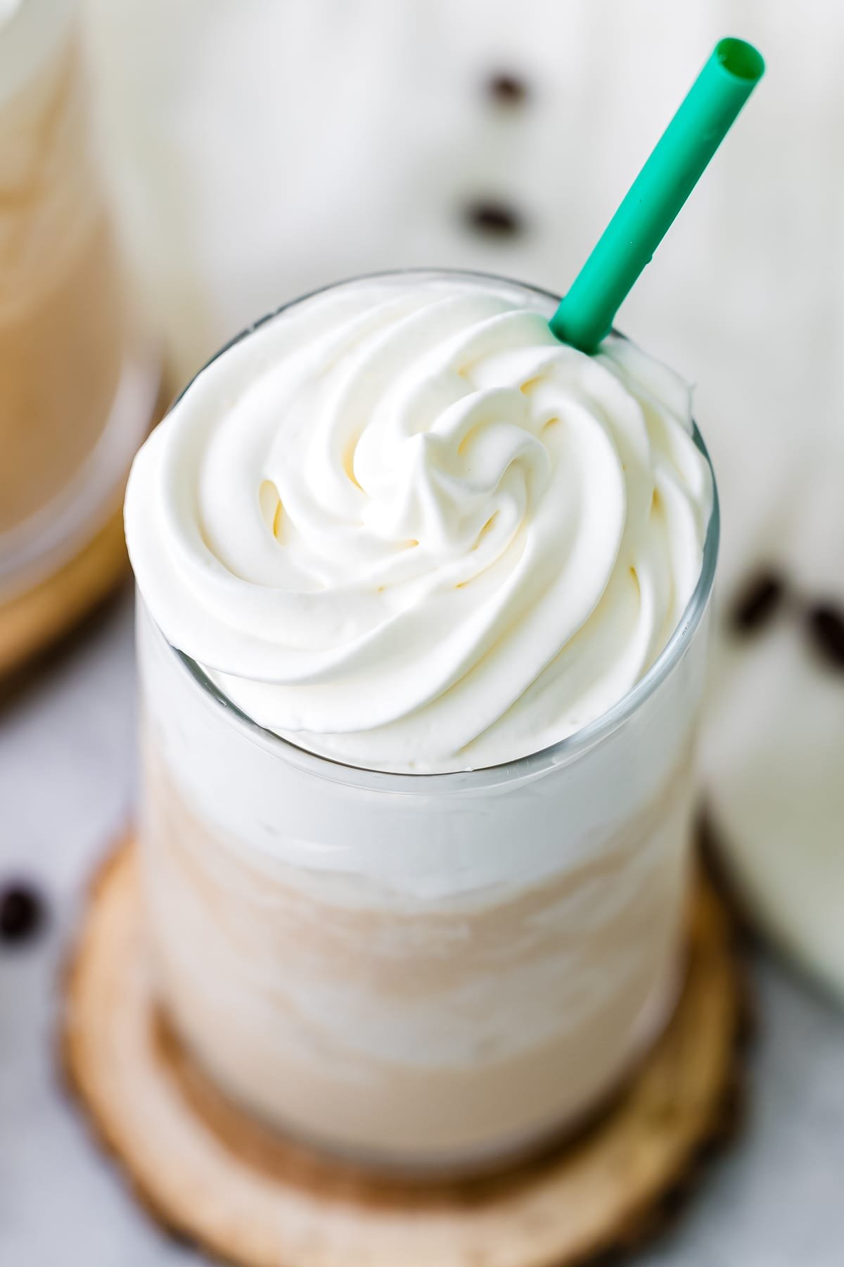 upclose white chocolate mocha in glass with green straw