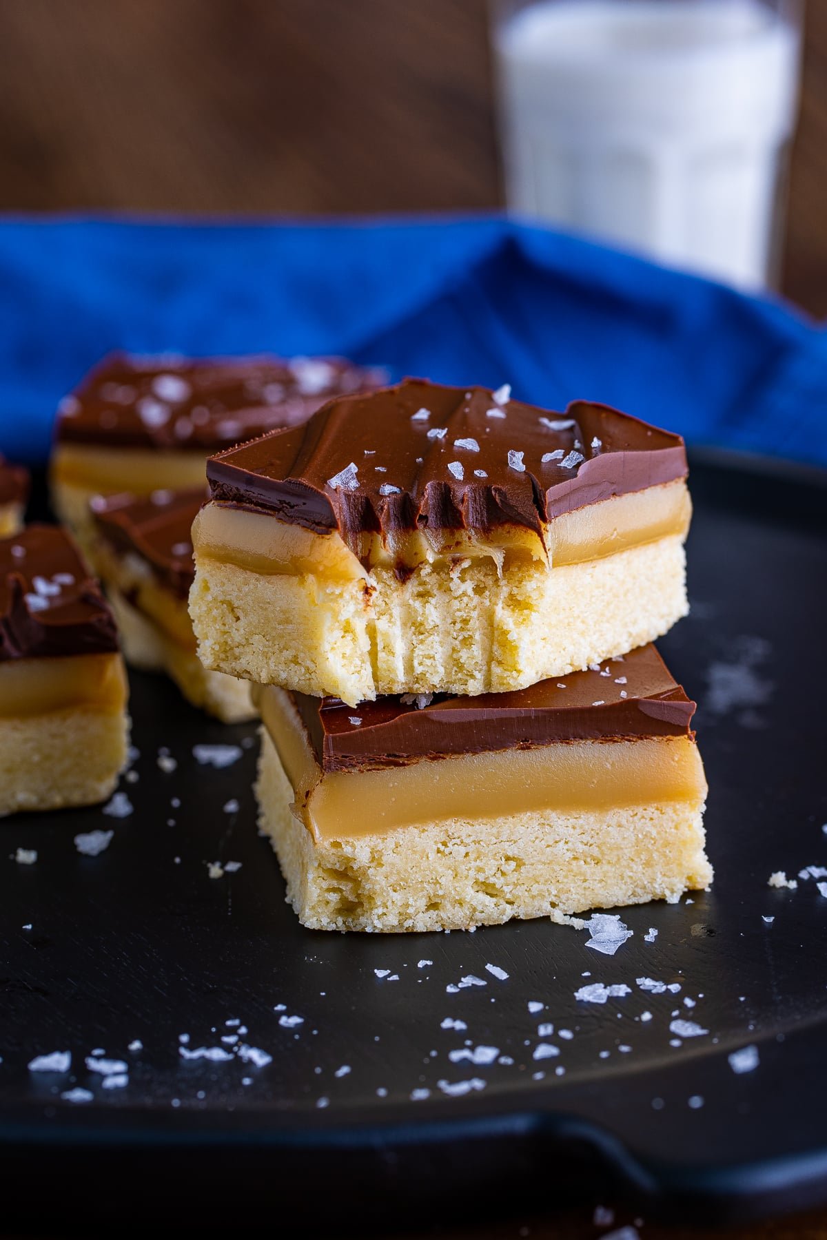 stacked millionaire shortbread recipe with bite taken out
