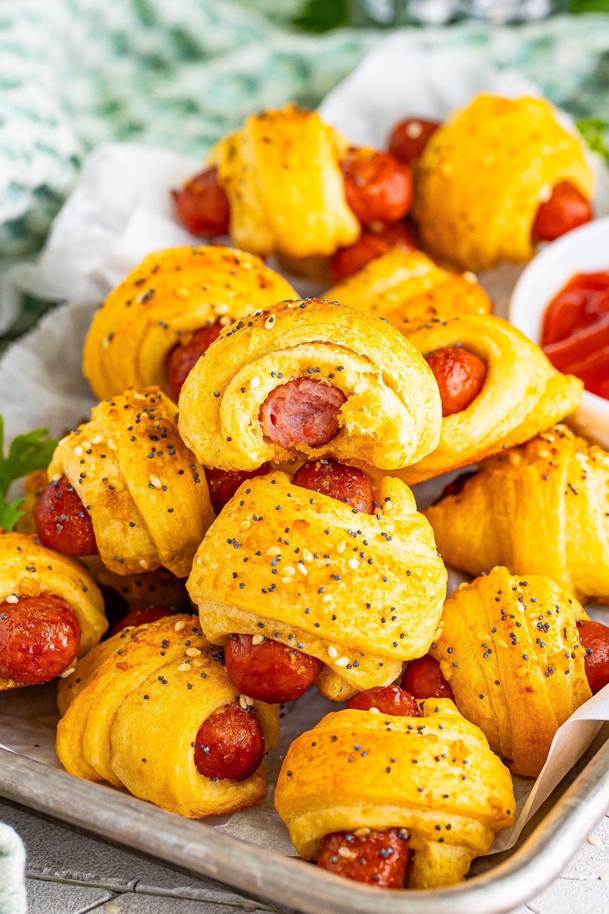 mini pigs in a blanket with a bite taken out