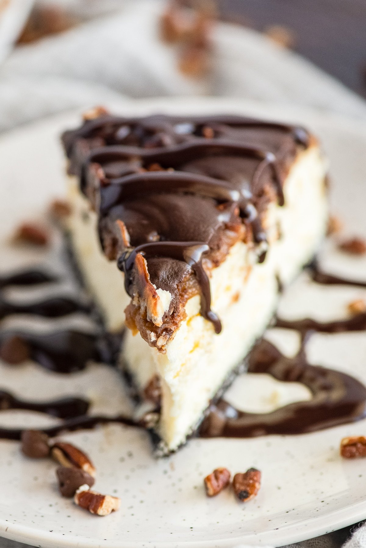turtle cheesecake recipe on a white plate