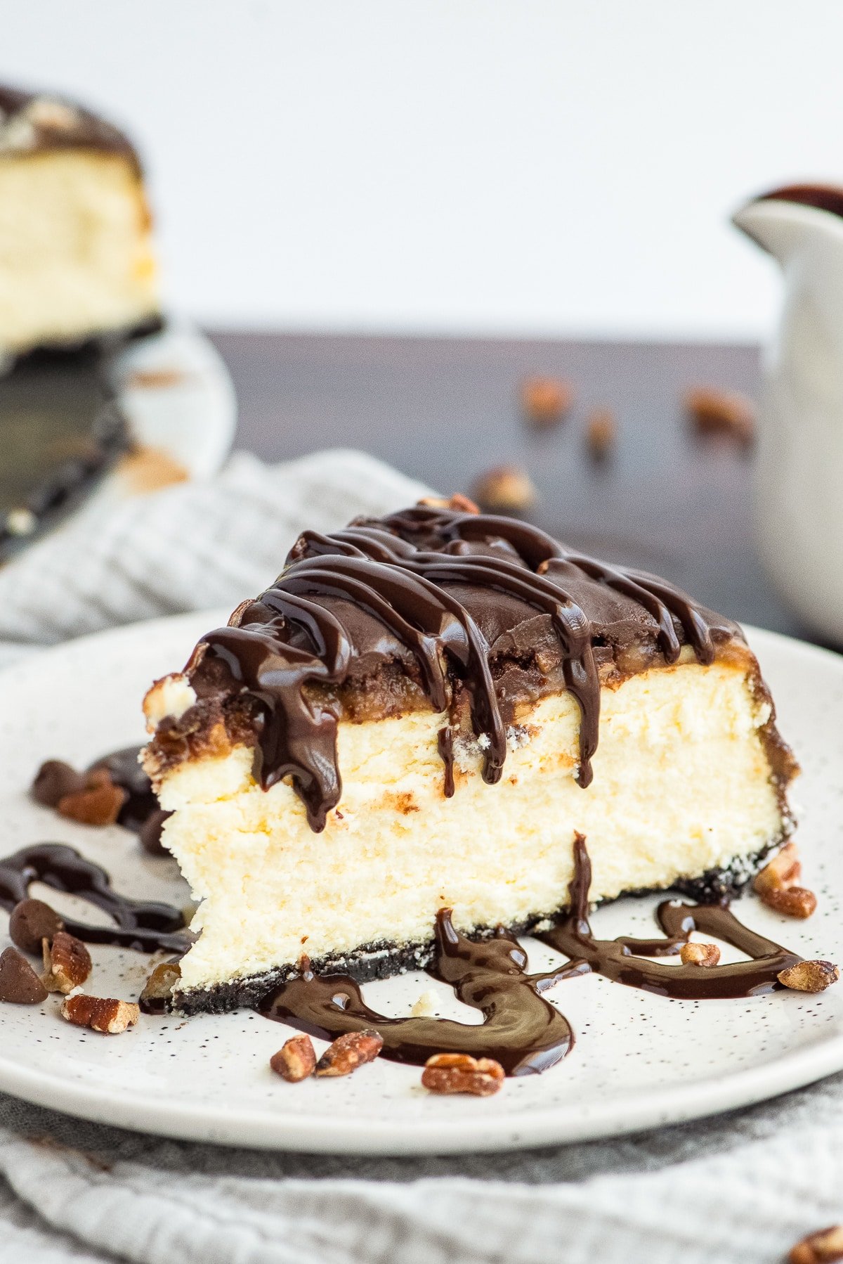 slice of turtle cheesecake recipe on white plate