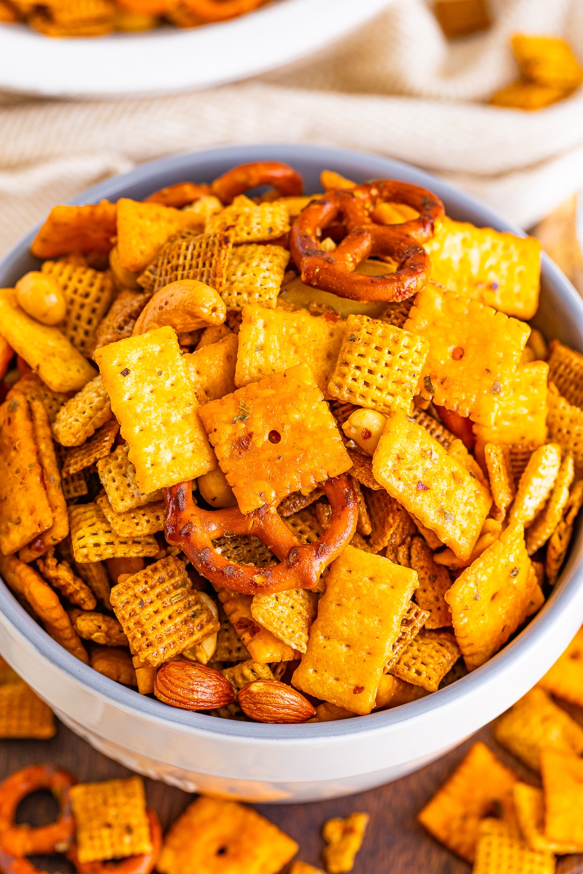 up close image of chex mix recipe in a white bowl
