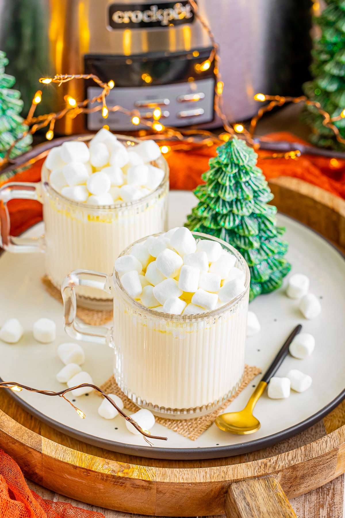 white hot chocolate in mugs on a serving platter