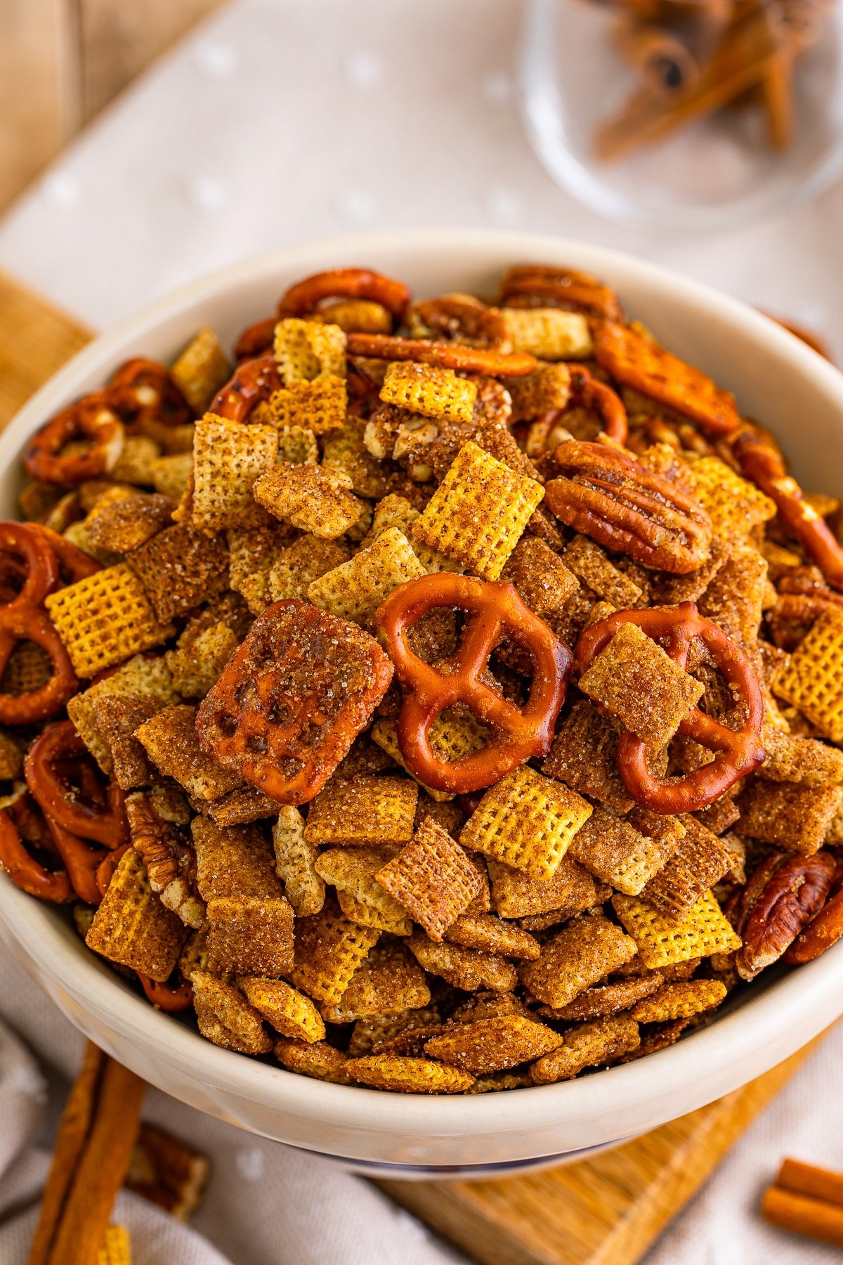 close up overhead image sweet chex mix recipe in tan bowl