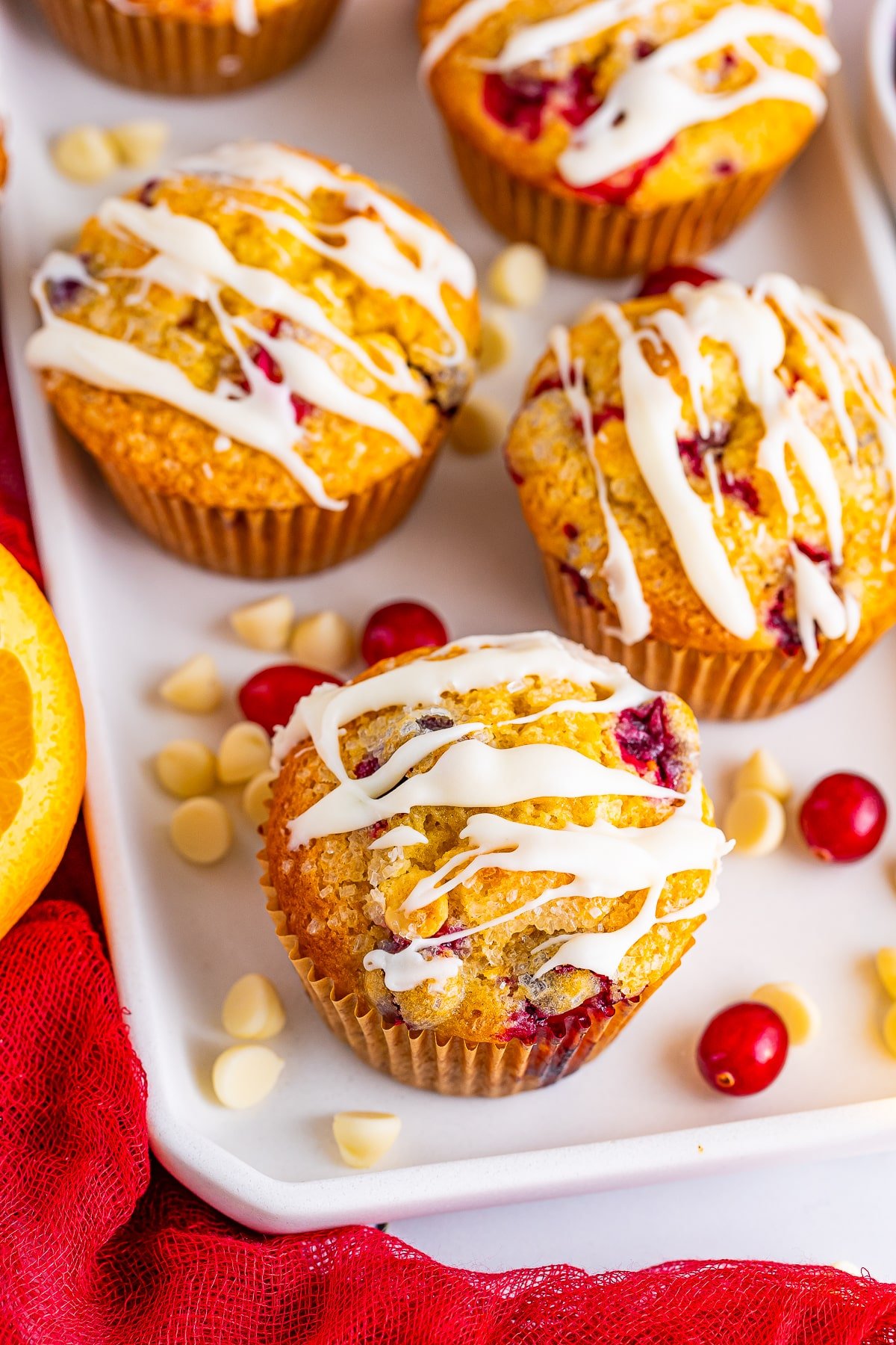 overhead image orange cranberry muffins on serving dish