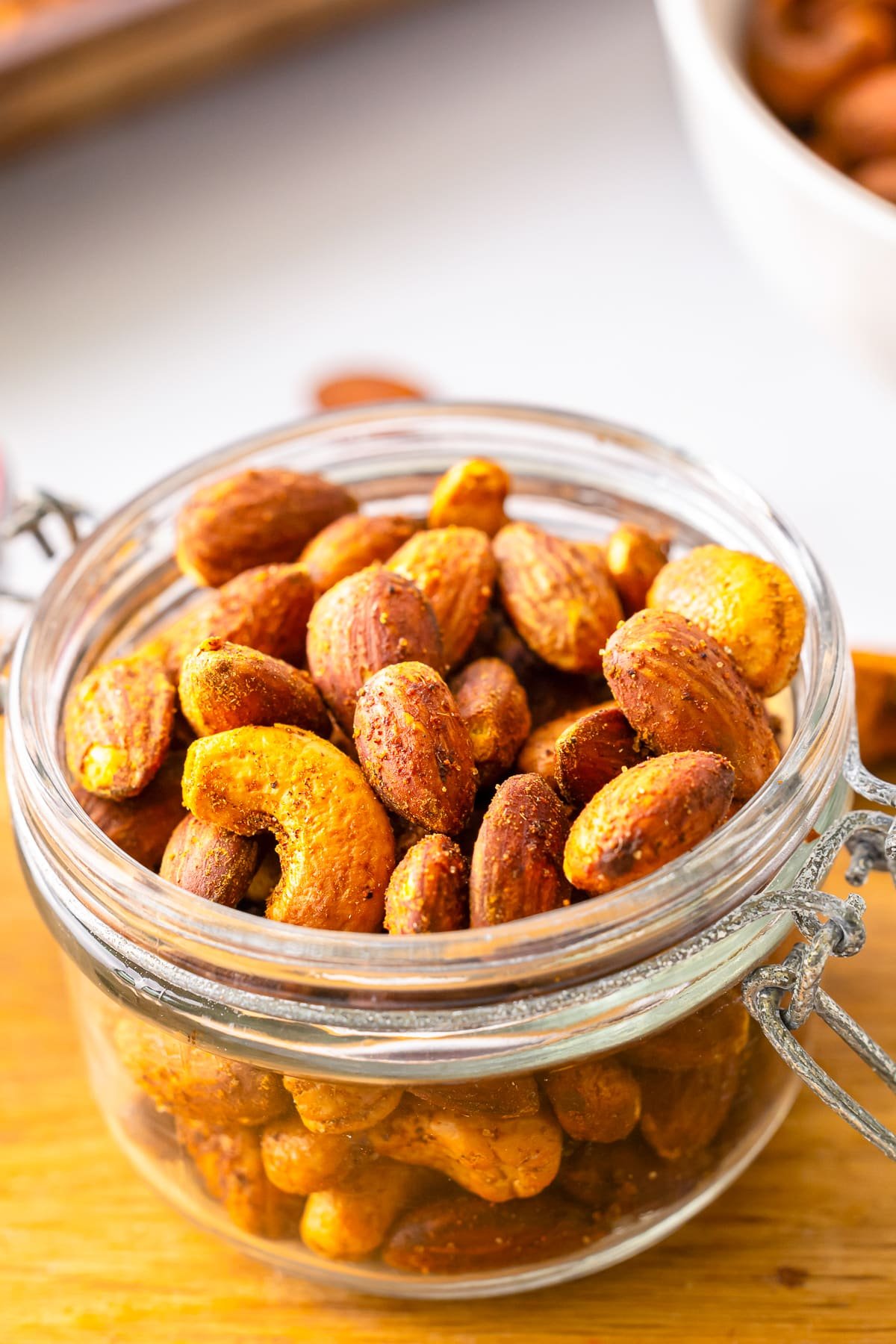 close up roasted nuts in a small glass jar