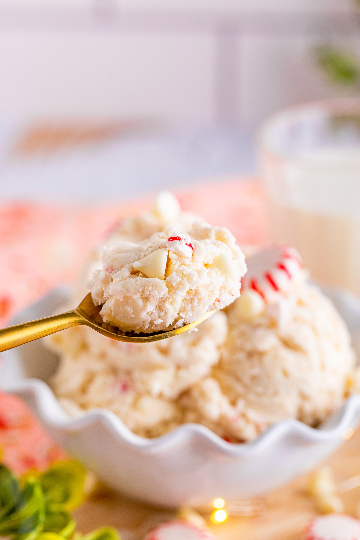 a spoon holding up a bite of easy edible cookie dough recipe in air