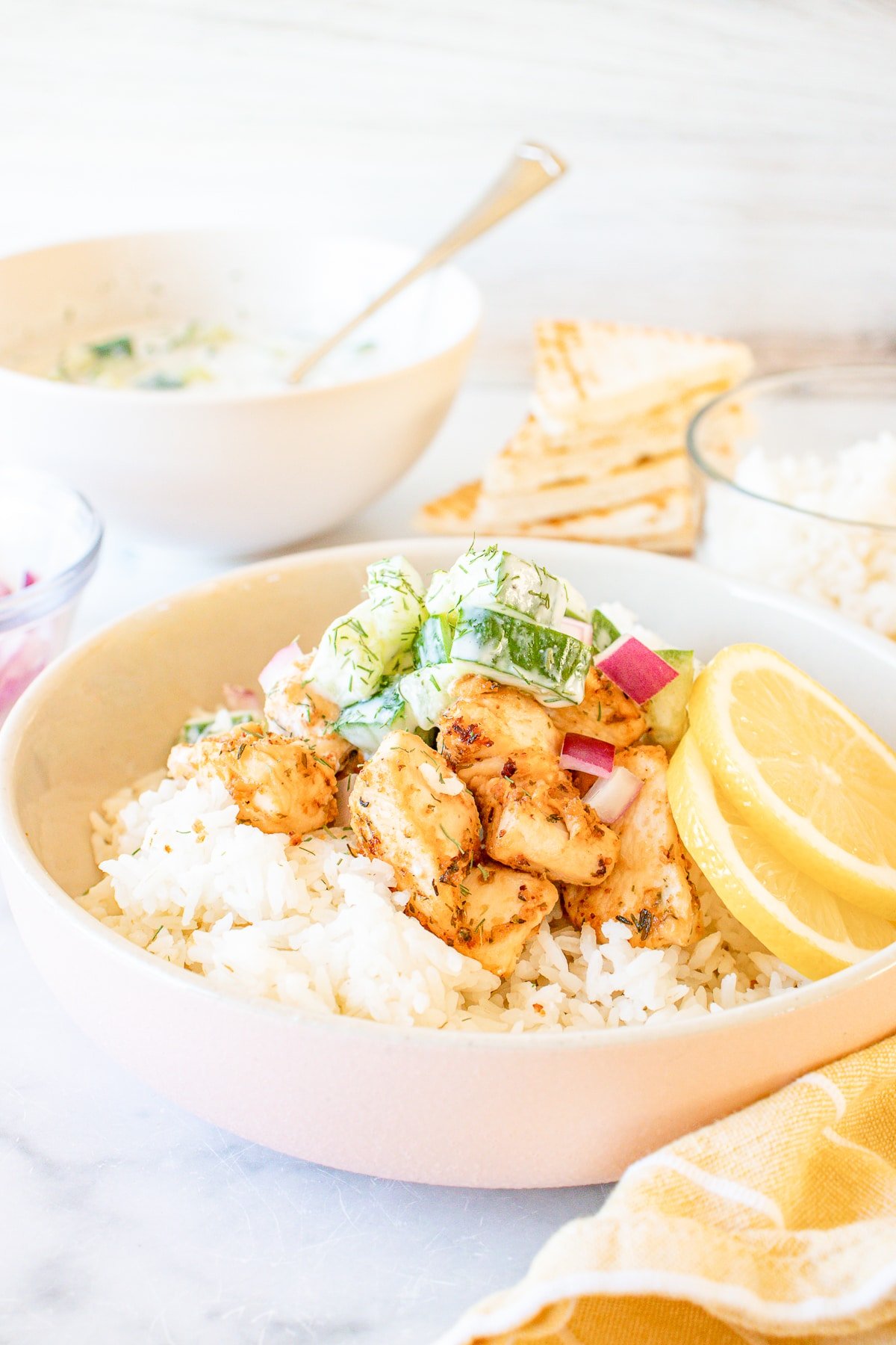 greek chicken bowls with yellow linen
