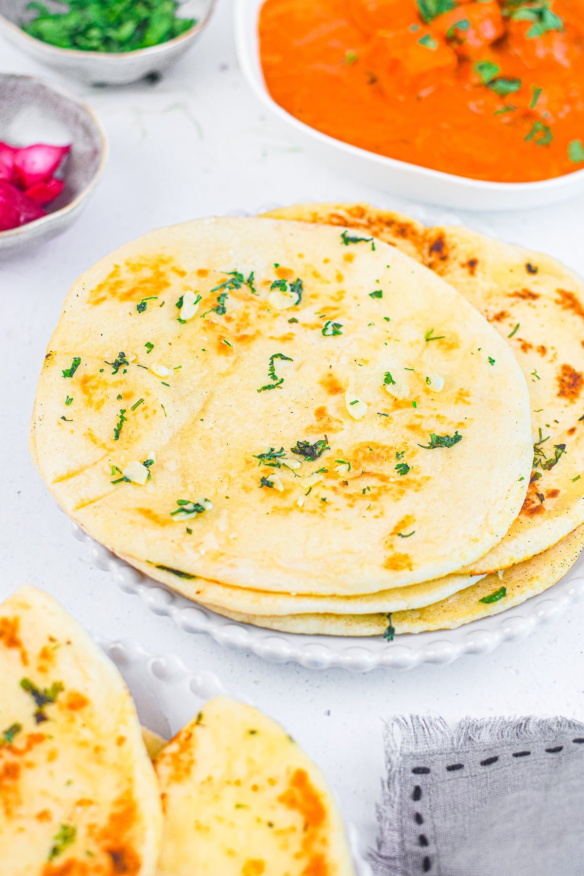 air fryer naan on a white serving plate