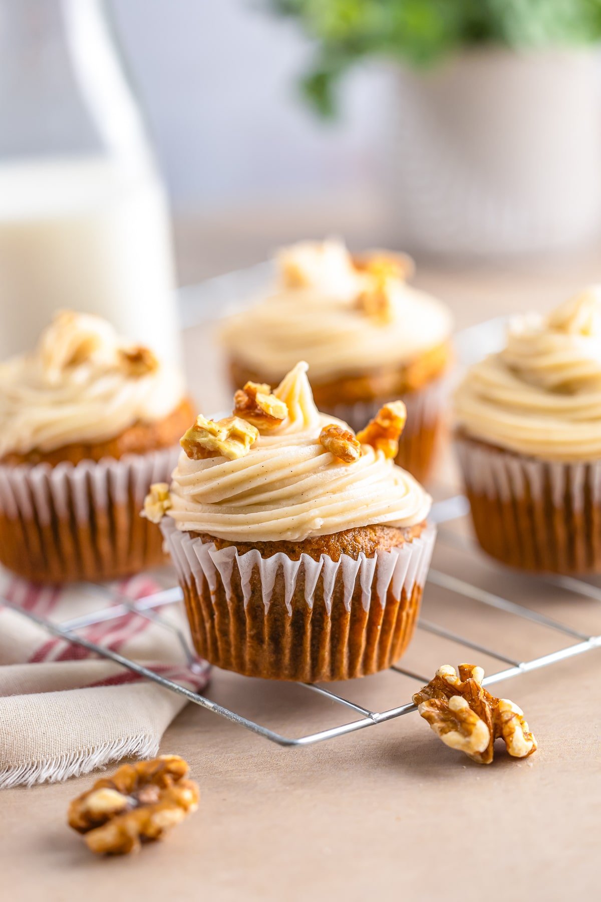 banana cupcakes recipe on a wire rack with walnuts